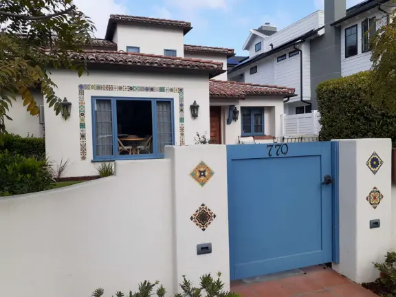 A walk among tropical trees and flowers, and the sweetest houses.