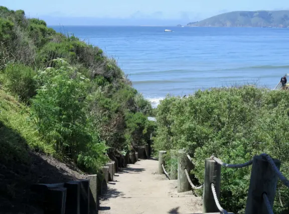 Walkway on the cliffs, in front of the resorts, that's bliss at sunset and in springtime when there are flowers galore. Take stairs down to a sheltered cove with tide pools.