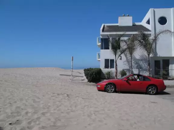 Wide beach with an abundance of white sand in a neighborhood of chic beach houses.