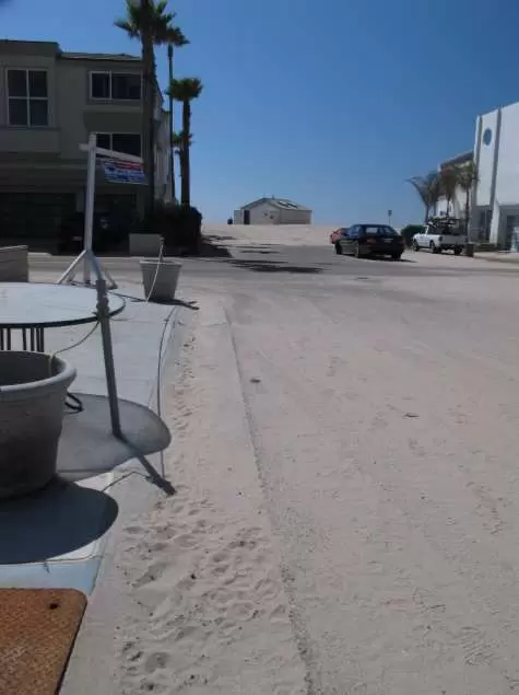 Wide beach with an abundance of white sand in a neighborhood of chic beach houses.