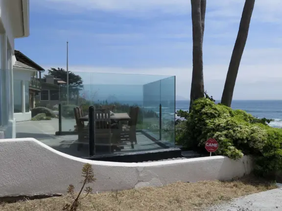 A pretty beachside town, with a wooden pier and wide windy beach with perfect views of Morro Rock, and colorful houses with gardens, backed by gently-sloping hills.