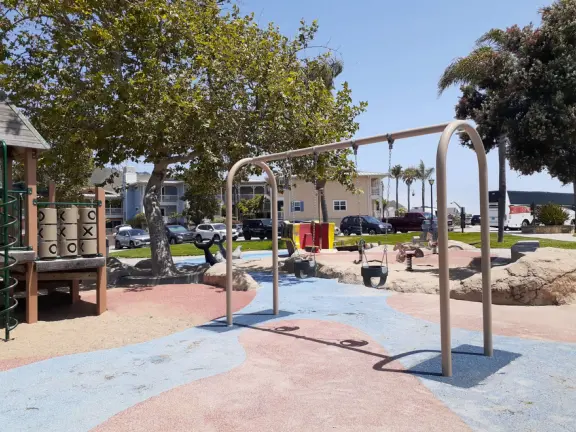 Colorful pirate playground by the sea, with lovely clean sand below the structure, right next door to the small but fun Central Coast Aquarium.