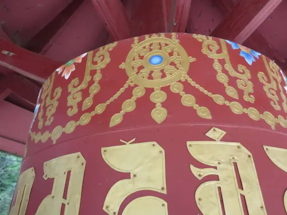 The public can come and walk the trail, turn the three prayer wheels, see the red temple and meditation hall, ring the chimes and gongs, and admire the sculptures.