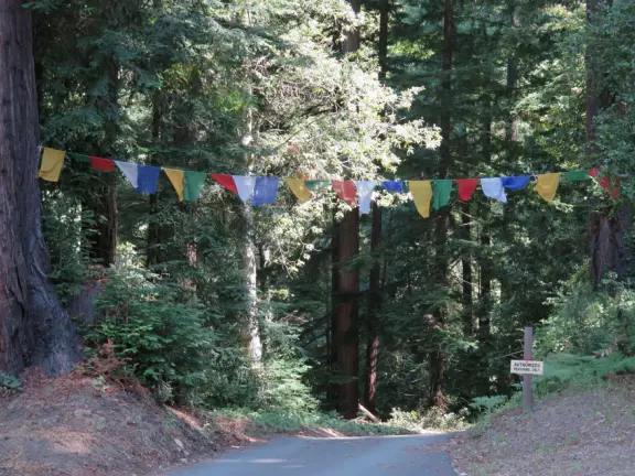 The public can come and walk the trail, turn the three prayer wheels, see the red temple and meditation hall, ring the chimes and gongs, and admire the sculptures.