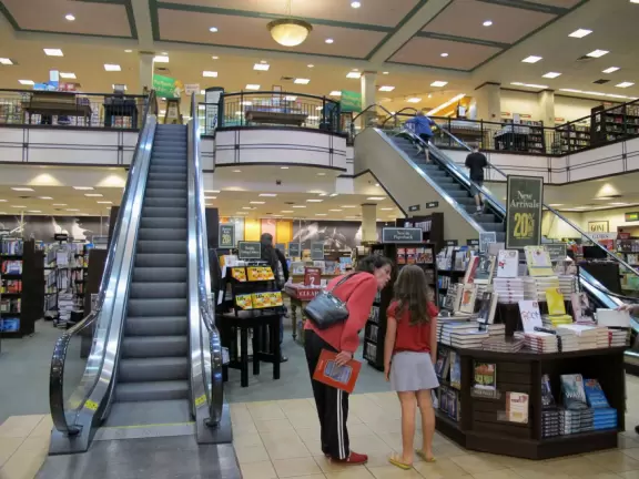 A shopping plaza with sidewalks cafes and shops that would look like Europe if it weren't so new!