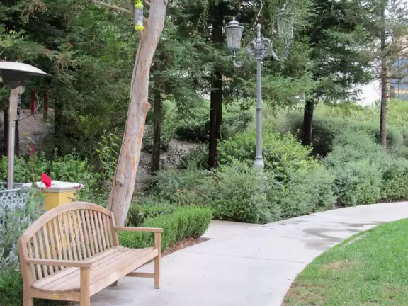 A shopping plaza with sidewalks cafes and shops that would look like Europe if it weren't so new!