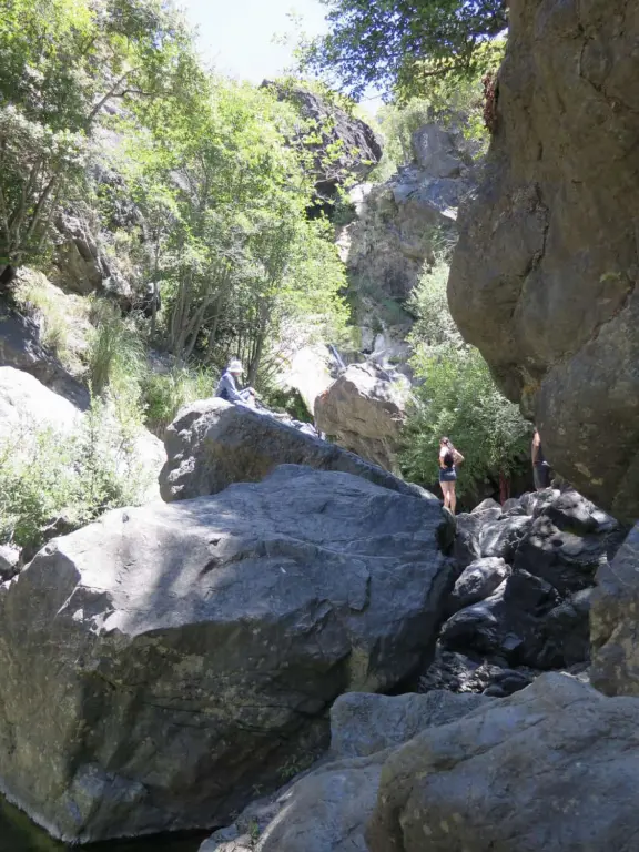 A very short hike in to huge boulders, bright trees, waterfalls, and a clear-water swimming hole. There is a longer hike, if you take the right fork.