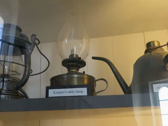 Lantern, keeper's table lamp, and oil filler can. 