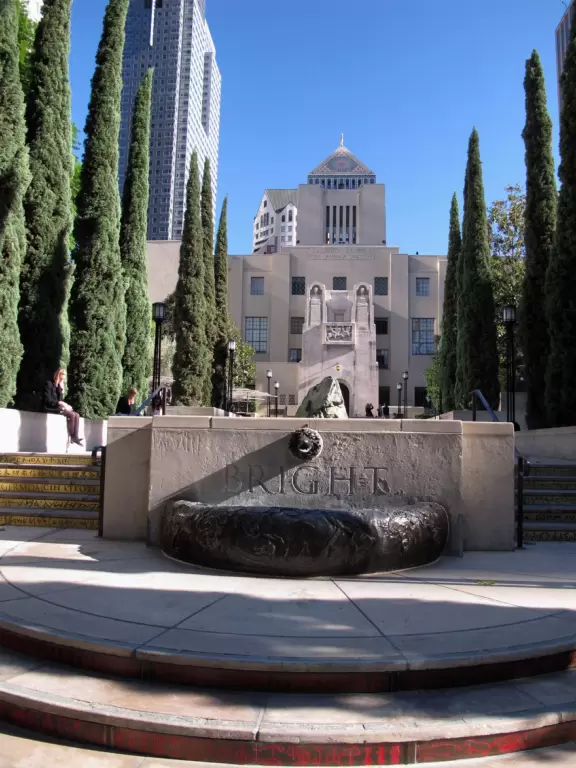 Dazzling new skyscrapers tower above fancy 1920s buildings.