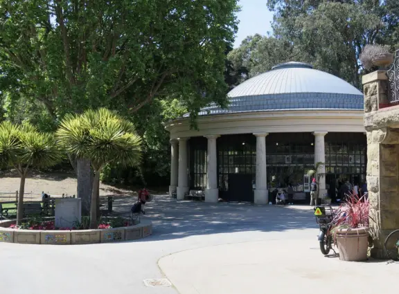 Antique carousel in round building, cute kiosk with fancy drinks, historic sandstone building, and children's playground with wave sculpture and huge slide down the hill!