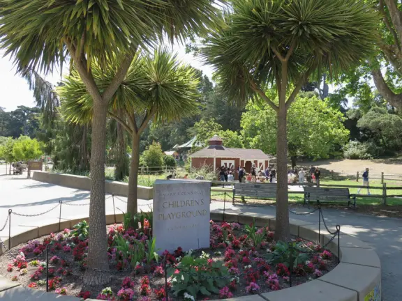Antique carousel in round building, cute kiosk with fancy drinks, historic sandstone building, and children's playground with wave sculpture and huge slide down the hill!