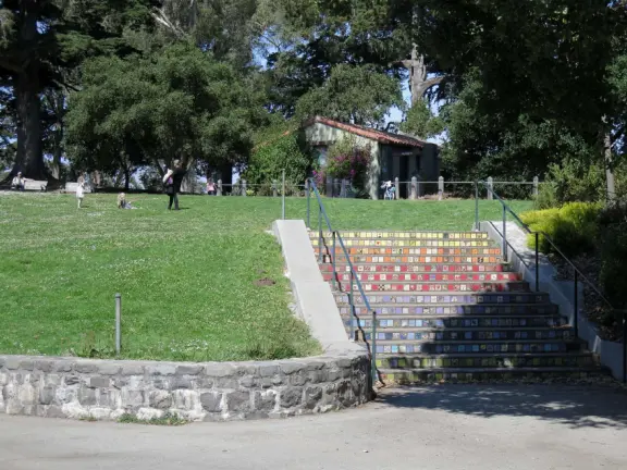 Antique carousel in round building, cute kiosk with fancy drinks, historic sandstone building, and children's playground with wave sculpture and huge slide down the hill!