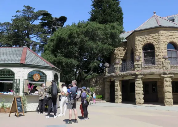 Antique carousel in round building, cute kiosk with fancy drinks, historic sandstone building, and children's playground with wave sculpture and huge slide down the hill!