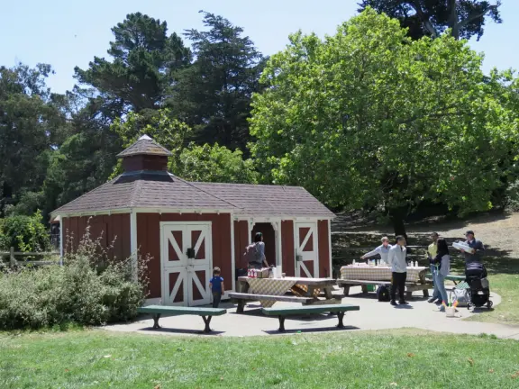 Antique carousel in round building, cute kiosk with fancy drinks, historic sandstone building, and children's playground with wave sculpture and huge slide down the hill!