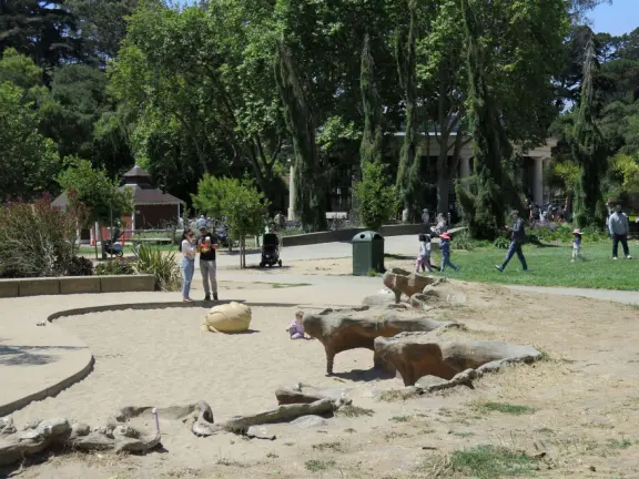 Antique carousel in round building, cute kiosk with fancy drinks, historic sandstone building, and children's playground with wave sculpture and huge slide down the hill!