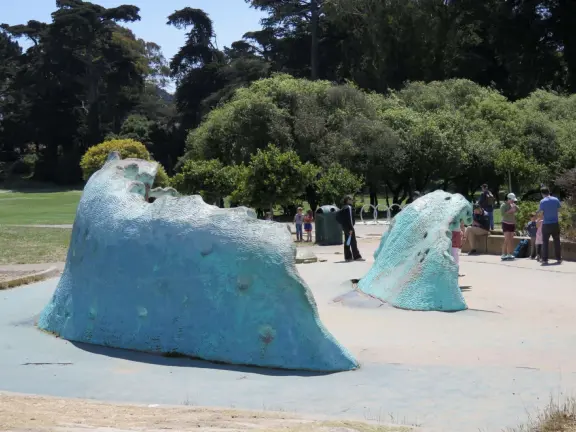 Antique carousel in round building, cute kiosk with fancy drinks, historic sandstone building, and children's playground with wave sculpture and huge slide down the hill!