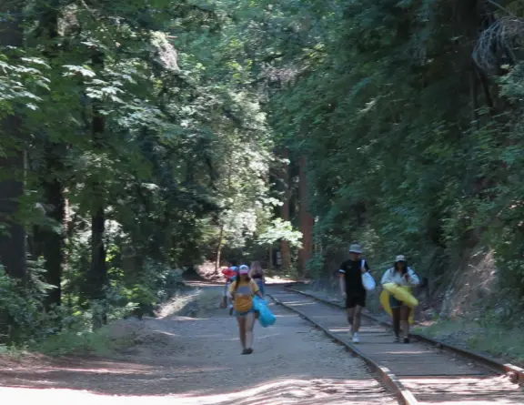 A gorgeous hike through redwoods to a pool in the river, with smooth white rocks to sit on.