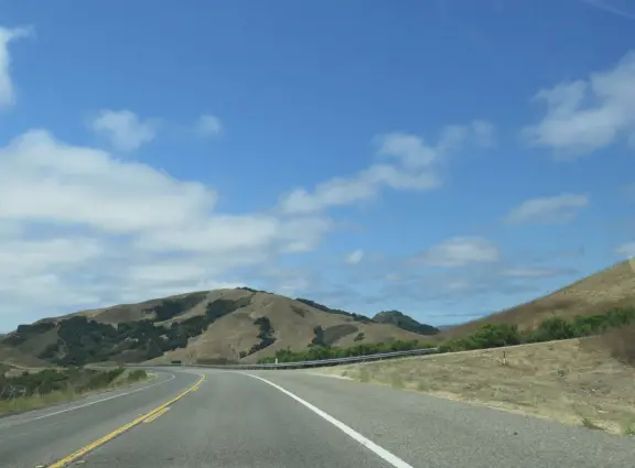 A beautiful drive above layers of hills, with views of the ocean. You pass wineries and farms to visit.