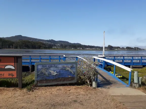 A tiny stretch of boardwalk in a beautiful setting on the estuary, with a coffee shop with a sunny patio facing the water, and cute cafes where you can relax.