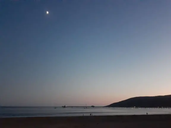 Colorful, pretty main street and boardwalk, with great cafes, lovely ship playground, and mesmerizing yellow cliffs.