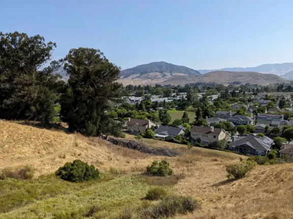 Hike with views of Cerro San Luis and Bishop Peak mountains and town, and then a tranquil valley on the other side.