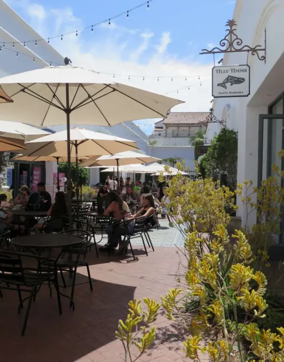 Street with beautiful historic arcades, cafes, and Spanish architecture.