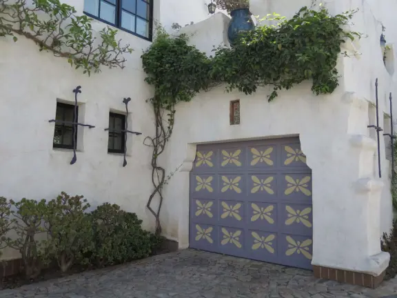 Whimsical masterpiece townhouses of vibrant colors, white-washed curves, and exquisite details, plus a Saturday farmer's market.