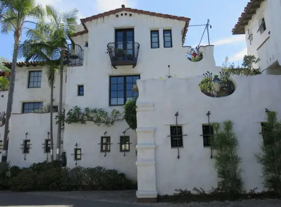 Whimsical masterpiece townhouses of vibrant colors, white-washed curves, and exquisite details, plus a Saturday farmer's market.