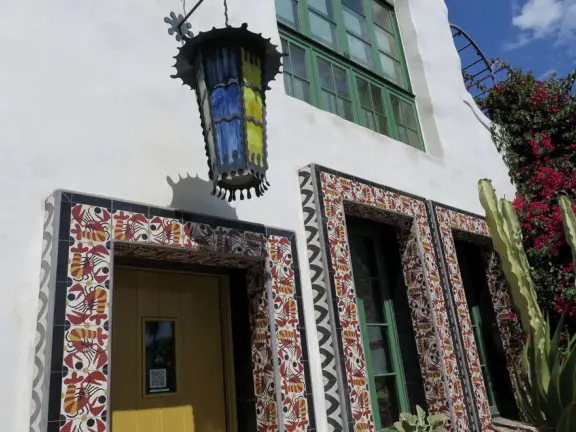 Whimsical masterpiece townhouses of vibrant colors, white-washed curves, and exquisite details, plus a Saturday farmer's market.