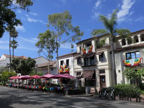 Street with beautiful historic arcades, cafes, and Spanish architecture.