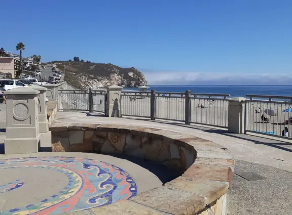Colorful, pretty main street and boardwalk, with great cafes, lovely ship playground, and mesmerizing yellow cliffs.