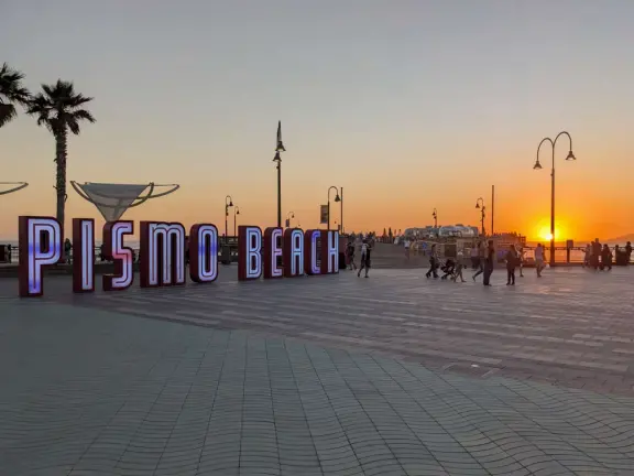 The wide plaza at the pier, at night.