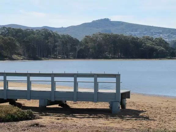 A tiny stretch of boardwalk in a beautiful setting on the estuary, with a coffee shop with a sunny patio facing the water, and cute cafes where you can relax.