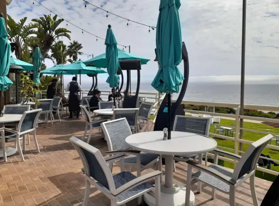 Walkway on the cliffs, in front of the resorts, that's bliss at sunset and in springtime when there are flowers galore. Take stairs down to a sheltered cove with tide pools.