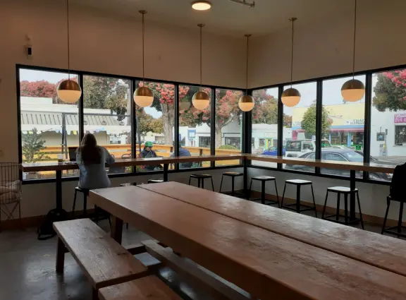 A lovely, hilly street with ocean views, lined with cute cafes.