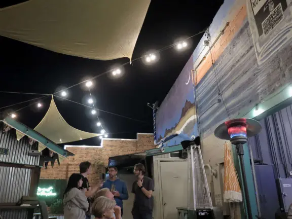 A main street of late 19th century storefronts, popular cafes, and a hip college scene. Recently, suffering an epidemic of homelessness relating to mental health problems.