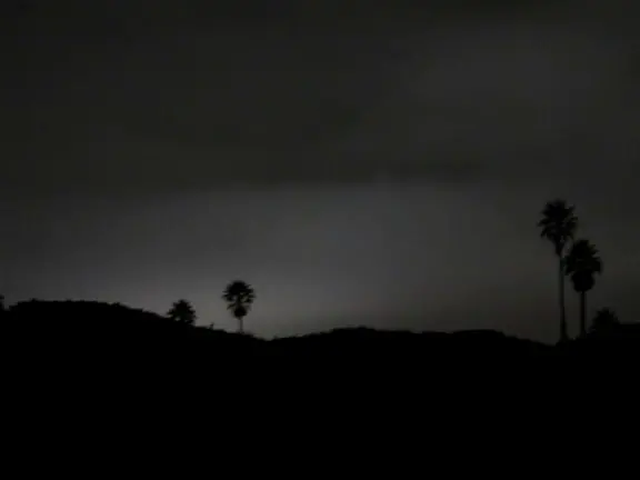 A glorious beach in Grover Beach town, with sand dunes and a wooden boardwalk, plus an octagon-shaped wooden pier in the sand.