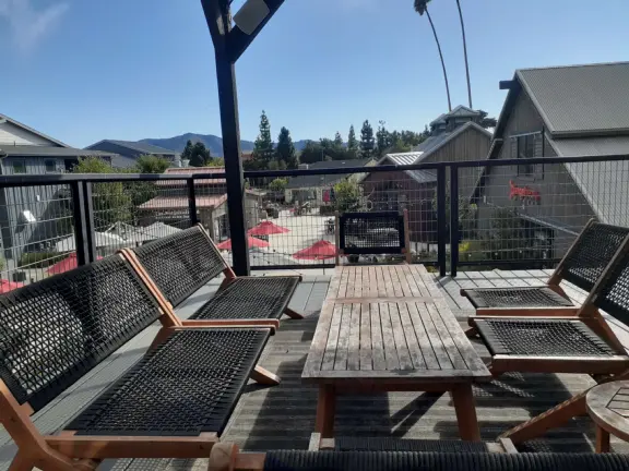 Attractive public market with sunny outdoor space and cute balcony upstairs.