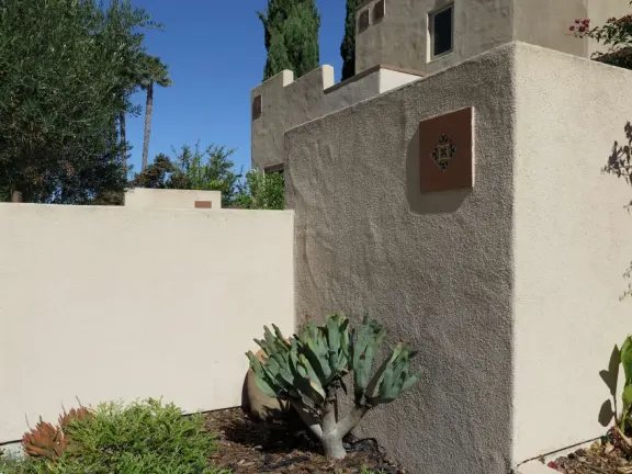 Hilltop park with basketball court with views, picnic tables, eucalyptus trees, and a difficult two-mile out-and-back trail.