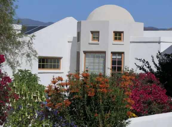 Hilltop park with basketball court with views, picnic tables, eucalyptus trees, and a difficult two-mile out-and-back trail.