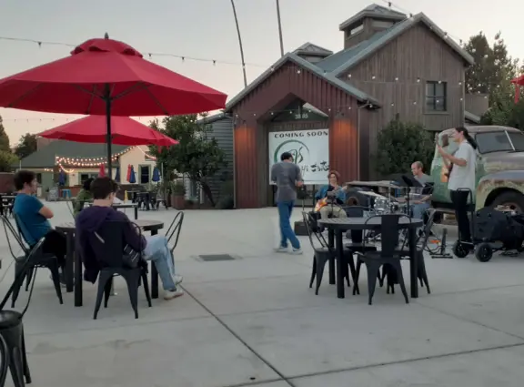Attractive public market with sunny outdoor space and cute balcony upstairs.