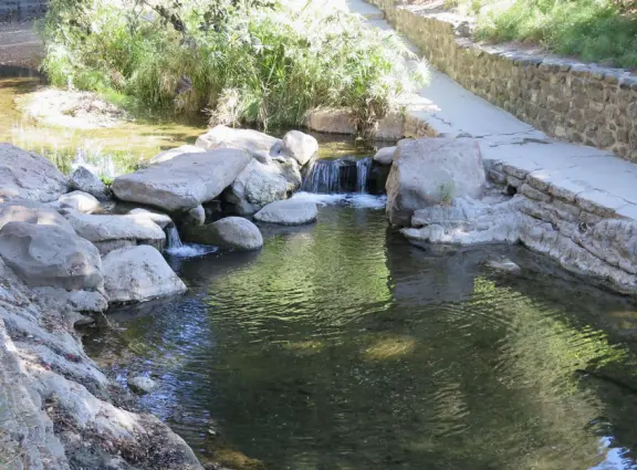 A main street of late 19th century storefronts, popular cafes, and a hip college scene. Recently, suffering an epidemic of homelessness relating to mental health problems.