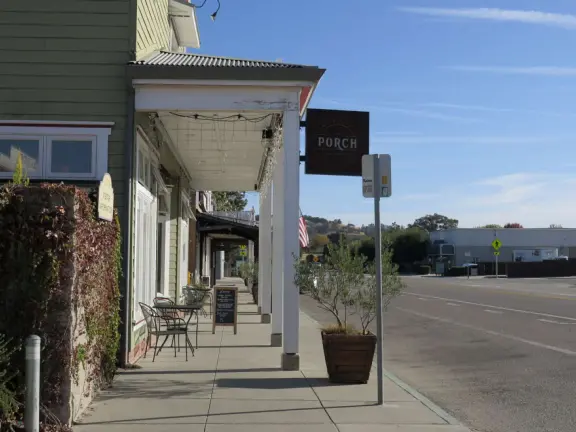 Small town with a few cafes on El Camino Real, some wineries, a sweet chapel, a playground, and pretty trees around houses along I Street.