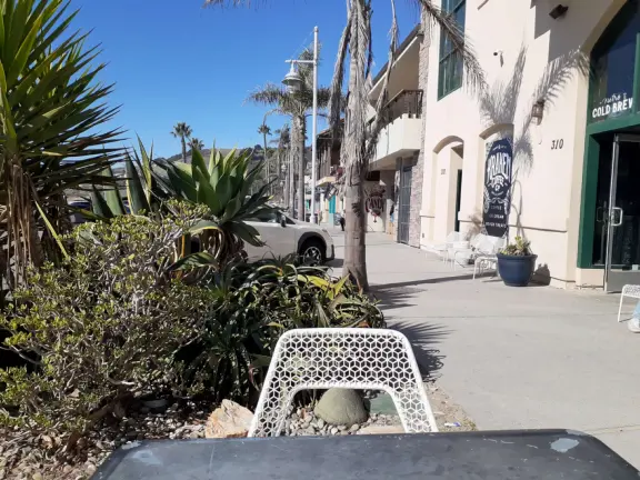 Colorful, pretty main street and boardwalk, with great cafes, lovely ship playground, and mesmerizing yellow cliffs.