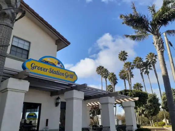 Cute area on Grand Avenue with colorful sidewalk, palm trees, ocean air, and a few good cafes.