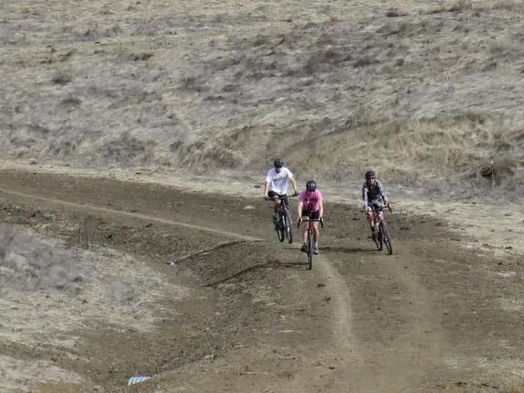 Wonderful wide open spaces with mountains of all shapes and sizes! First mile is shady. Four mile out and back, or five mile lollipop loop hike. Optional detours: architecture creations, or mountaintop swing.