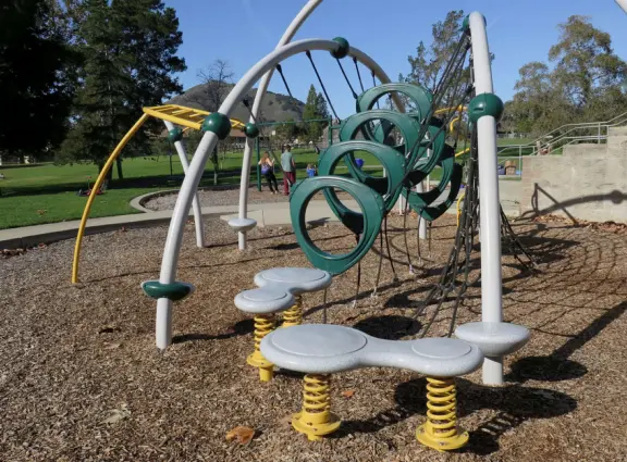 A lush park with rolling hills to run on, one-mile loop walking path, and basketball and sand volleyball courts. Currently has a crime problem.