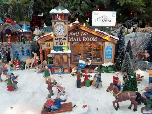 Festive beach with white cliffs, popular playground, pier, and cafe coming soon.