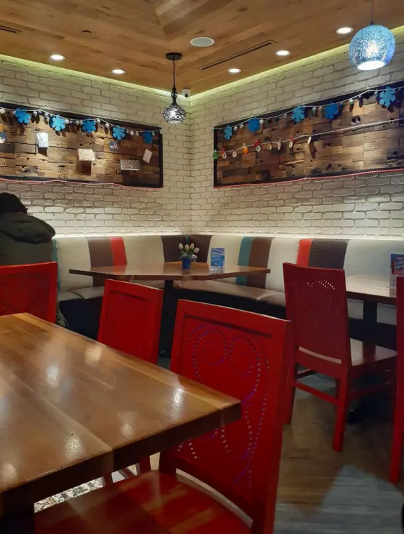 A pretty mall filled with flower pots and giant sized games, with views of the mountains and plenty of stores for kids!