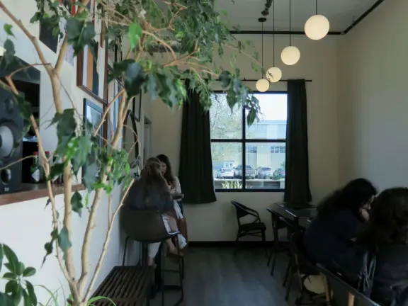 Attractive public market with sunny outdoor space and cute balcony upstairs.